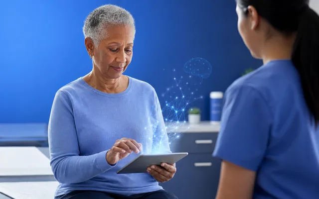 Older patient completing a tablet-based cognitive screen in a calm primary care exam room